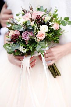 wedding bouquet in bride's hands