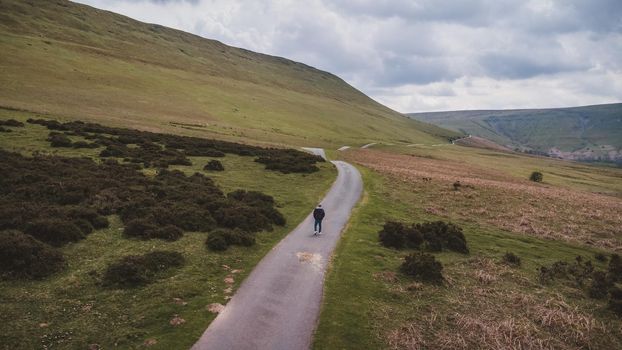 A man walking alone in nature.