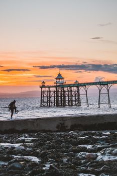 Man playing football near the Clevedon Pier.