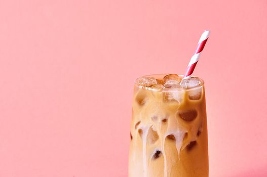 Close-up Iced Coffee with Milk in Tall Glasses on Pink Background. Concept Refreshing Summer Drink.