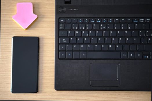 Closeup view of businessman holding modern smartphone on hands, Man working at sunny office at workplace. High quality photo