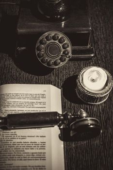 old phone on wooden table with book. High quality photo