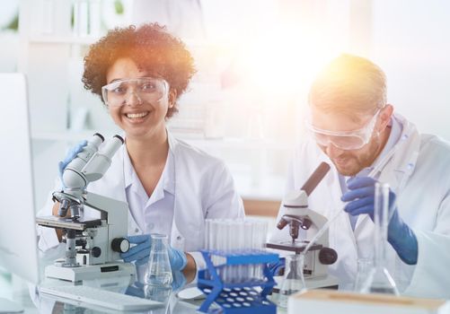 Scientists smiling together in lab