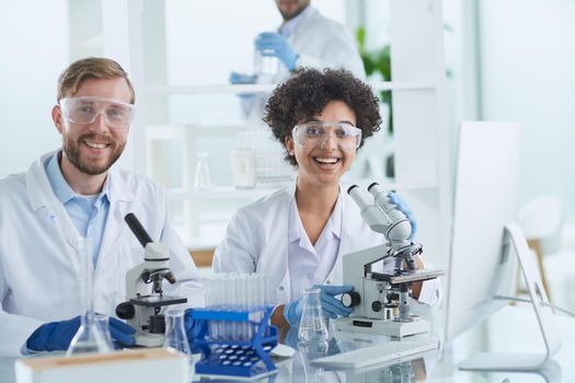 Scientists smiling together in lab