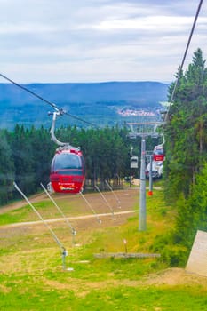 Harz Germany 18. August 2013 Wurmberg ride with the red gondola cable car railway with panorama view to mountain landscape of Braunlage Harz Goslar in Lower Saxony Germany.