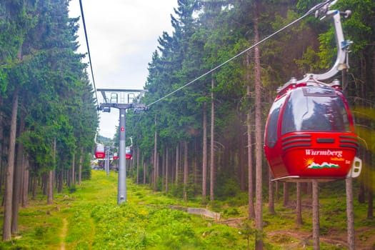 Harz Germany 18. August 2013 Wurmberg ride with the red gondola cable car railway with panorama view to mountain landscape of Braunlage Harz Goslar in Lower Saxony Germany.