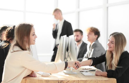 young employees shaking hands at a successful presentation . success concept