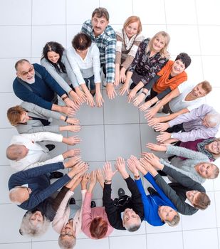 top view. group of mature people showing their unity