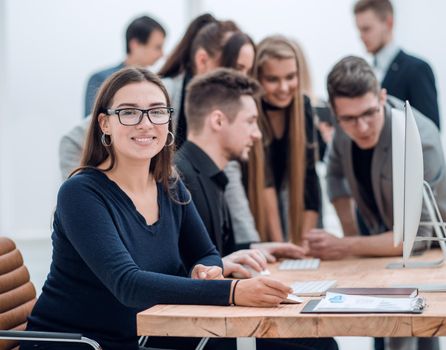 young business woman sitting at a Desk. the concept of professionalism