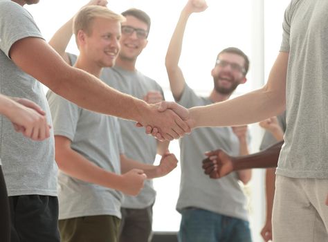 close up. handshake of members of the contact group, to applause