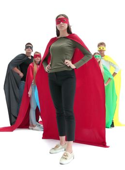 in full growth. confident young woman in a red cloak of a superhero . photo with copy space