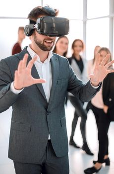 close up. a young businessman in a virtual reality helmet. people and technology