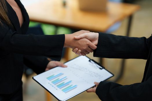 Business partnership meeting concept. Image business woman handshake. Successful business people handshaking after good deal. Group support concept