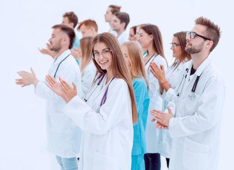 female doctor and her colleagues give a standing ovation . success concept