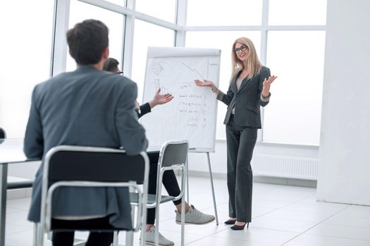 businesswoman makes a presentation of the new project in a spacious conference room