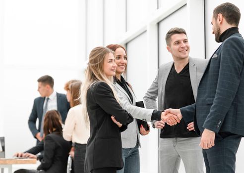 business colleagues greeting each other with a handshake. office workdays