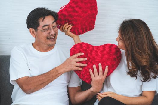Happy Asian senior couple having good time at home. Old people retirement and healthy citizens elderly concept.