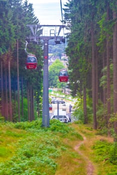 Harz Germany 18. August 2013 Wurmberg ride with the red gondola cable car railway with panorama view to mountain landscape of Braunlage Harz Goslar in Lower Saxony Germany.