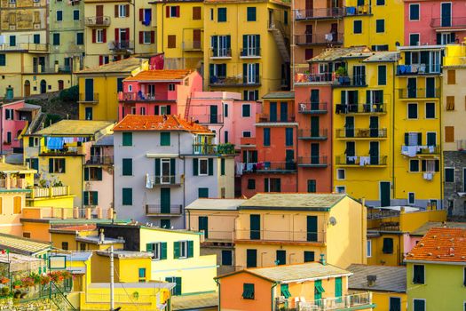 Colorful houses in Manarola Village, Cinque Terre Coast of Italy. Manarola is a beautiful small town in the province of La Spezia, Liguria, north of Italy and one of the five Cinque terre attractions.