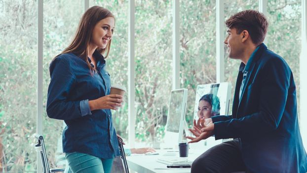 Happy businesswoman and businessman having conversation in modern office. Business corporate and community concept.