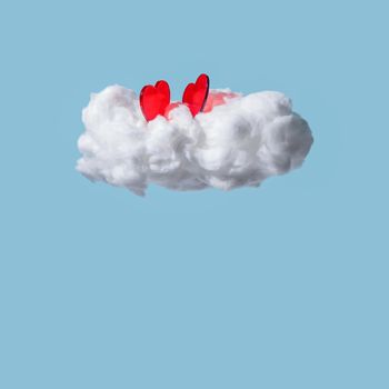 Red hearts on cloud isolated on blue background. Valentine's day. Square with copy space.