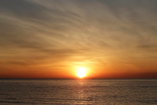 photograph of the sunrise from the sea and the beautiful sky and morning clouds