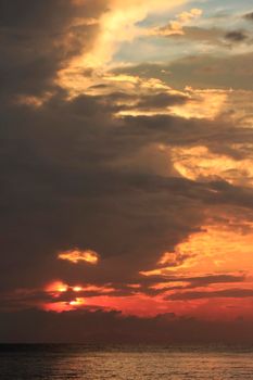 photograph of the sunrise from the sea and the beautiful sky and morning clouds