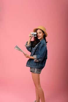 young asian woman backpacker traveler with camera map. journey trip travel. studio shot