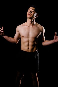 portrait of athletic muscular bodybuilder man with naked torso six pack abs. fitness workout concept