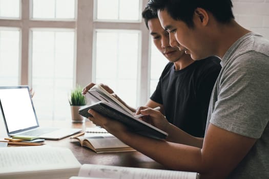 designer working on graphic tablet discussing creative idea of startup project with partner