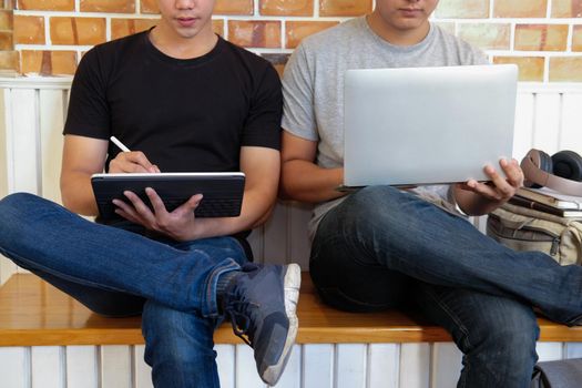 designer working on computer graphic tablet discussing creative idea of startup project with partner