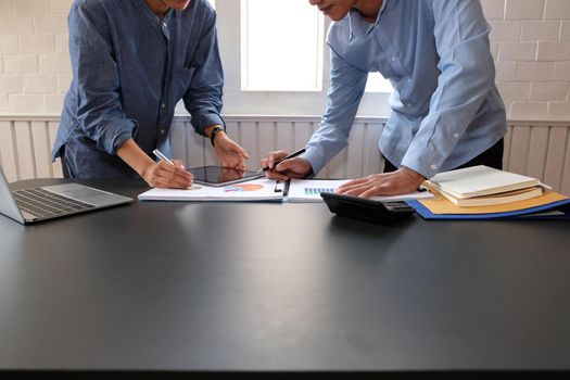 business people have a meeting. businessman using tablet working on performance revenue with co-worker team.