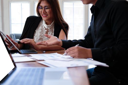 businesswoman working discussing with colleague. business people have a meeting. businessman working on startup project with co-worker team.