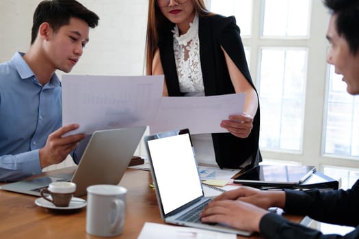 executive businesswoman advising analyzing discussing business project with co-worker team