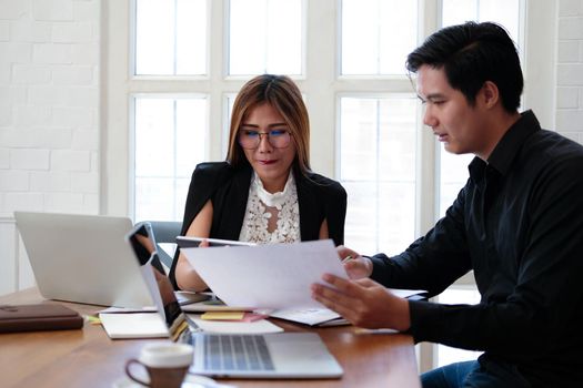 businesswoman working discussing with colleague. business people have a meeting. businessman working on startup project with co-worker team.