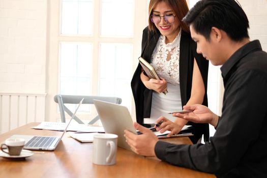 executive businesswoman advising analyzing discussing business project with co-worker team