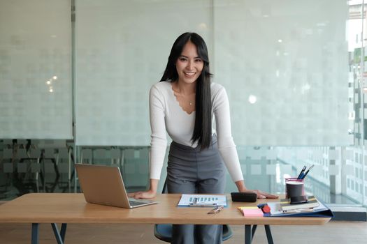 young confident asian executive businesswoman woman smiling at business workplace