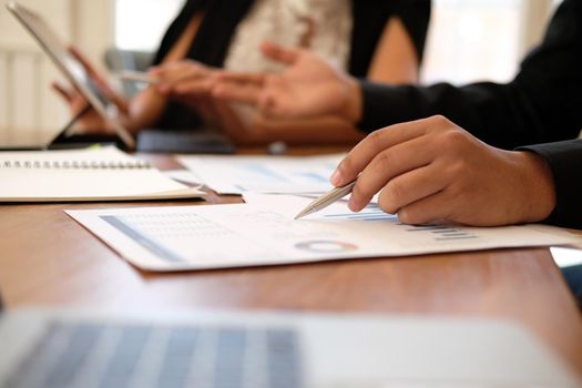 businesswoman working discussing with colleague. business people have a meeting. businessman working on startup project with co-worker team.