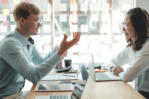 business people discussing on performance revenue in meeting. businessman working with co-worker team. financial adviser analyzing data with investor.