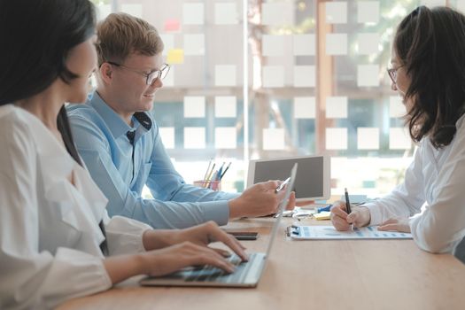 business people discussing on performance revenue in meeting. businessman working with co-worker team. financial adviser analyzing data with investor.