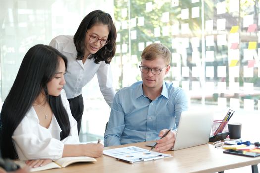 business people discussing on performance revenue in meeting. businessman working with co-worker team. financial adviser analyzing data with investor.