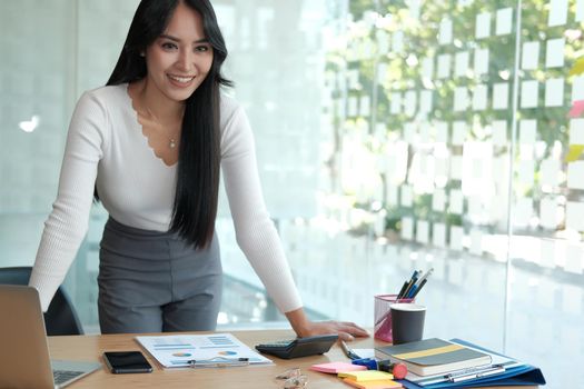 young confident asian executive businesswoman woman smiling at business workplace