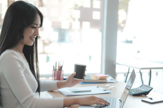 businesswoman freelancer working with computer at office. startup woman entrepreneur analyzing data at workplace. student studying doing assignment