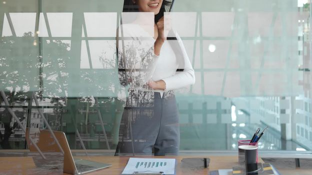 young confident asian executive businesswoman woman smiling at business workplace