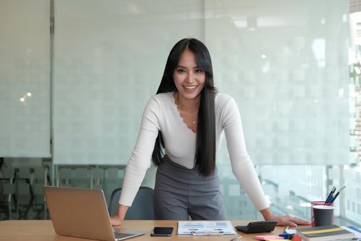 young confident asian executive businesswoman woman smiling at business workplace