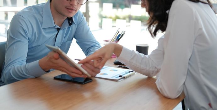 business people discussing on performance revenue in meeting. businessman working with co-worker team. financial adviser analyzing data with investor.