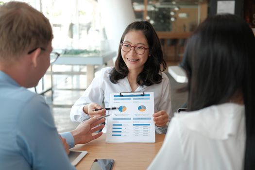 business people discussing on performance revenue in meeting. businessman working with co-worker team. financial adviser analyzing data with investor.