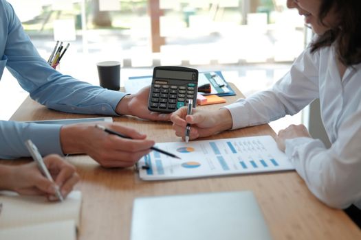 business people discussing on performance revenue in meeting. businessman working with co-worker team. financial adviser analyzing data with investor.