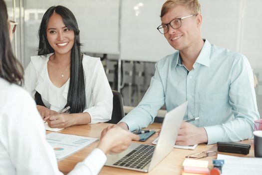 business people discussing on performance revenue in meeting. businessman working with co-worker team. financial adviser analyzing data with investor.