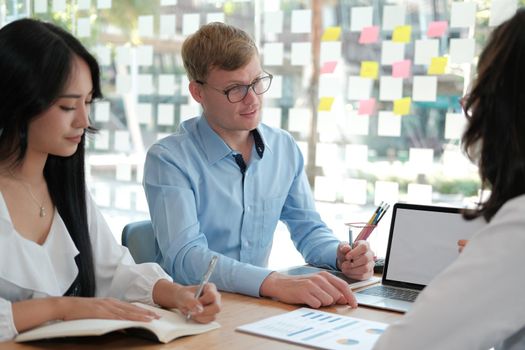 business people discussing on performance revenue in meeting. businessman working with co-worker team. financial adviser analyzing data with investor.